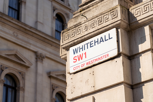 London, UK - Close-up of a street sign for Whitehall in central London,  the location for several UK Government departments.