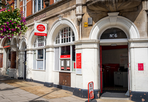 London, UK - The street entrance to a Post Office in North London.