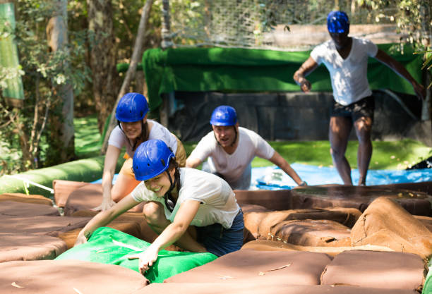 istock Two teams compete on an obstacle course in an amusement park. 1333976590