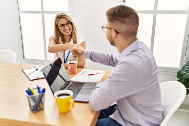 istock Two business workers smiling happy celebrating agreement with handshake at the office. 1333976789