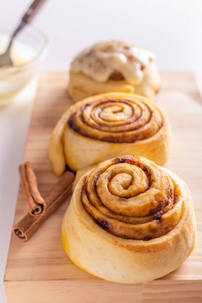 istock Sweet homemade cinnamon roll, bun with cinnamon powder 1333978184