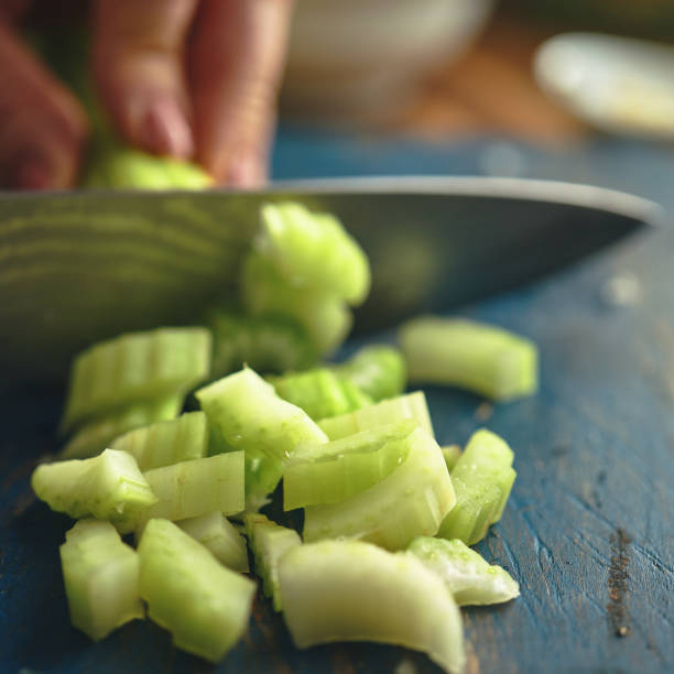 istock Preparing Chicken Noodles Soup with Fresh Vegetables 1333980543