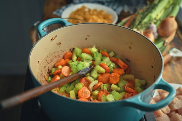 Preparing Chicken Noodles Soup with Fresh Vegetables