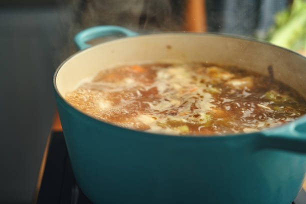 istock Preparing Chicken Noodles Soup with Fresh Vegetables 1333981824