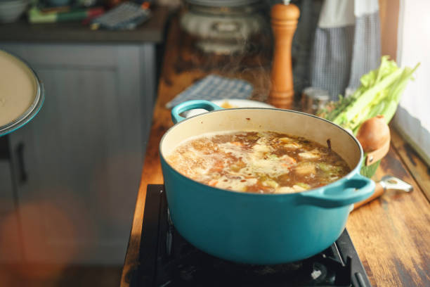 istock Preparing Chicken Noodles Soup with Fresh Vegetables 1333981851