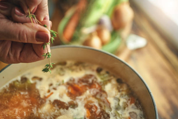 istock Preparing Chicken Noodles Soup with Fresh Vegetables 1333981879