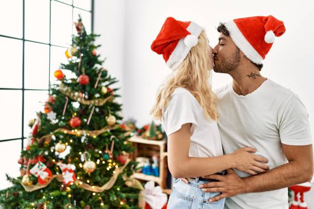 Free Stock Photo of Couple Kissing in Front of a Christmas Tree ...