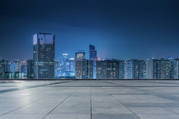 istock empty ground floor with modern cityscape at night. 1333988919