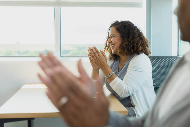 istock Adult students clap for unseen lecturer after presentation 1333989478