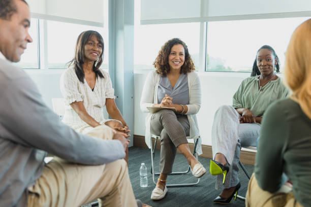 istock Multi-ethnic group of colleagues sit in circle for employee engagement 1333989493
