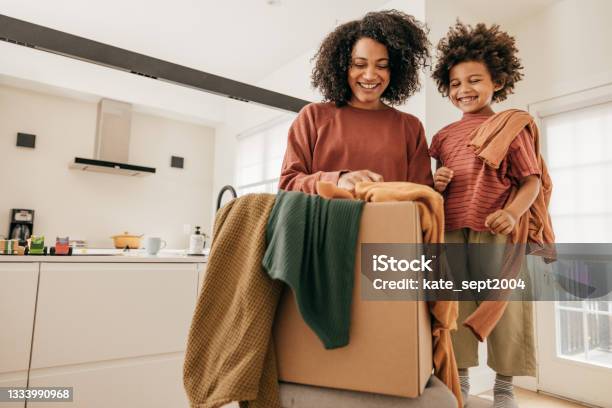 How To Encourage Your Kids To Do Household Chores Stock Photo - Download Image Now - Clothing, Donation Box, Charity and Relief Work