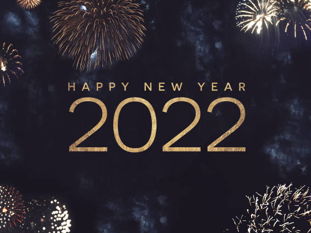 Happy New Year 2022 Text Holiday Graphic with Gold Fireworks Background in Night Sky Happy New Year 2022 Text Holiday Celebration Graphic with Gold Fireworks Background in Night Sky 2022 stock pictures, royalty-free photos & images