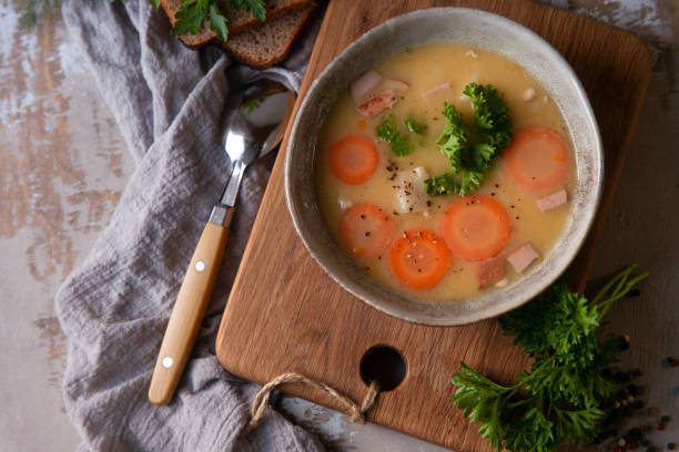 istock Fresh homemade made split pea soup with fresh parsley in country rustic kitchen, flat lay, copy space 1333994149