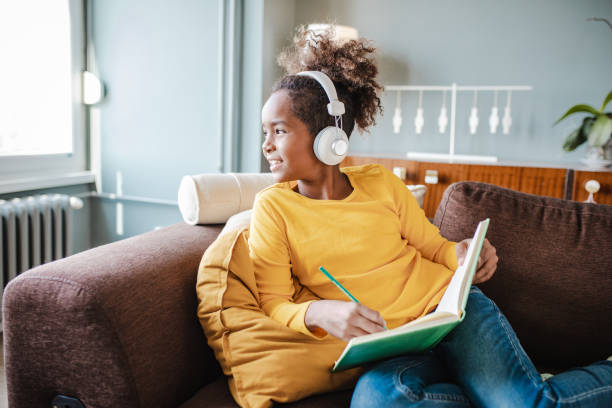 istock Llittle girl is studying at home 1333995924