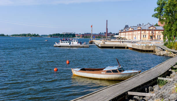 Vaasa, Finland: 28 July, 2021: Vaasa harborfront with the old harbormaster building and several boats at the docks