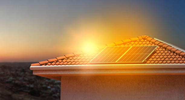 istock Solar energy panels  over a beautiful sunset sky city backgound. Space For Text. 1334001284