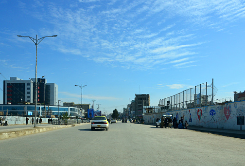 Mazar-e-Sharif, Balkh province, Afghanistan: approaching the city center on Balkh Gate Boulevard, reaching Ghanzafar roundabout, on the left the Afghanistan International Bank building (the largest bank in Afghanistan).