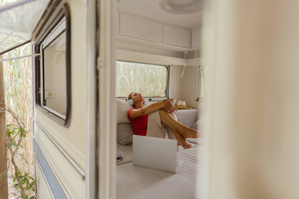 istock Female freelancer enjoying in a camper van after online work 1334009892
