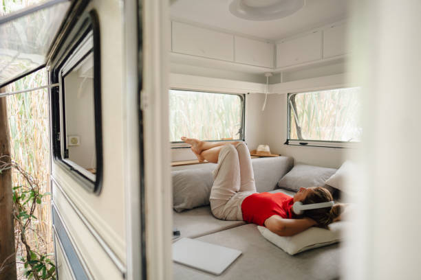 istock Female freelancer enjoying in a camper van after online work 1334010005