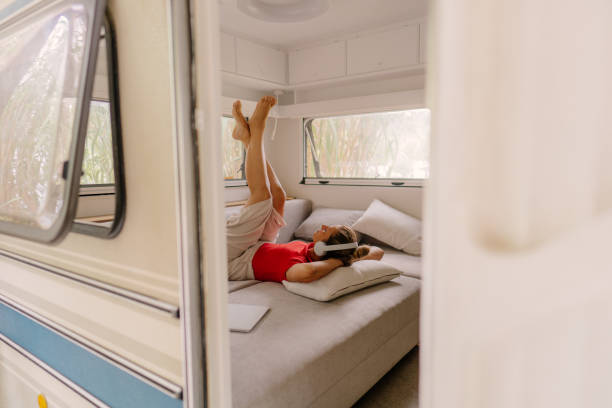 istock Female freelancer enjoying in a camper van after online work 1334011043