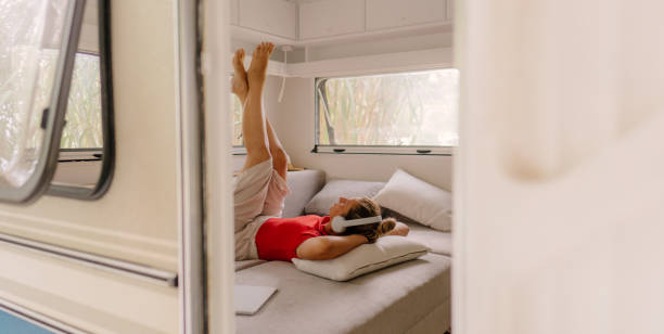 istock Female freelancer enjoying in a camper van after online work 1334011050