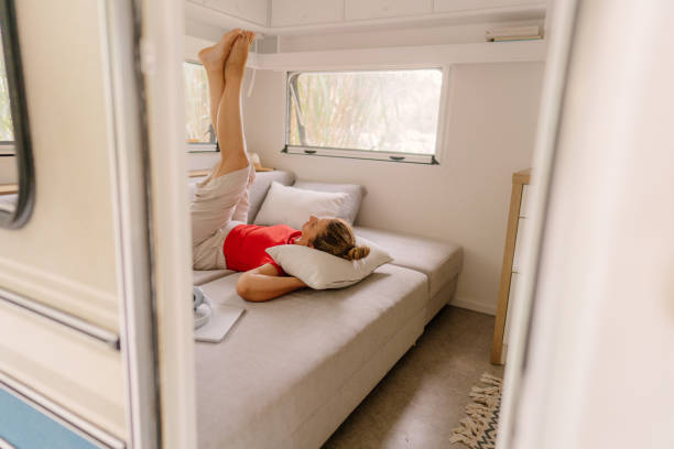 istock Female freelancer enjoying in a camper van after online work 1334011052