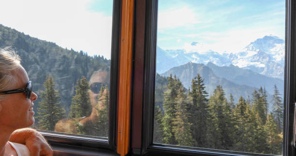 istock Woman relaxes in train, riding up mountain 1334011334