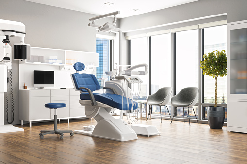Interior of an empty modern dental clinic room.