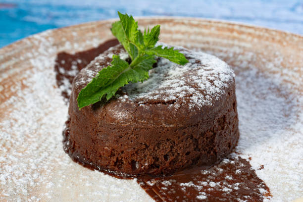 istock dessert chocolate fountain, with mint and chocolate on a plate 1334018418