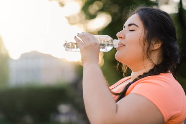 istock dehydrated woman water thirst overweight drinking 1334022447
