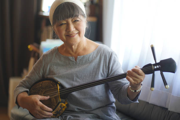 Woman playing the sanshin
