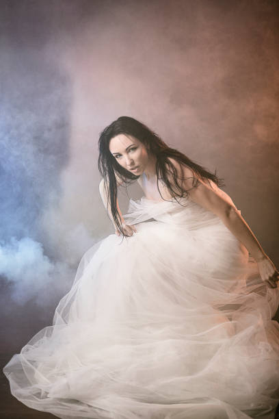 istock Photomodel posing with a white tulle. 1334031475