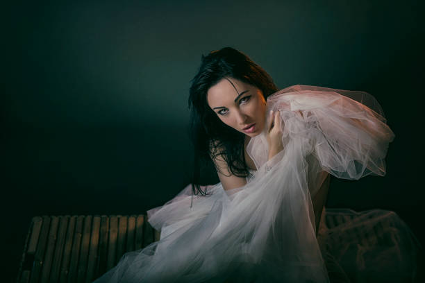 istock Photomodel posing with a white tulle. 1334031494