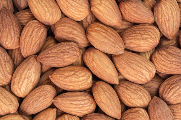 istock Close up raw almonds texture background. Vegetable food 1334035944