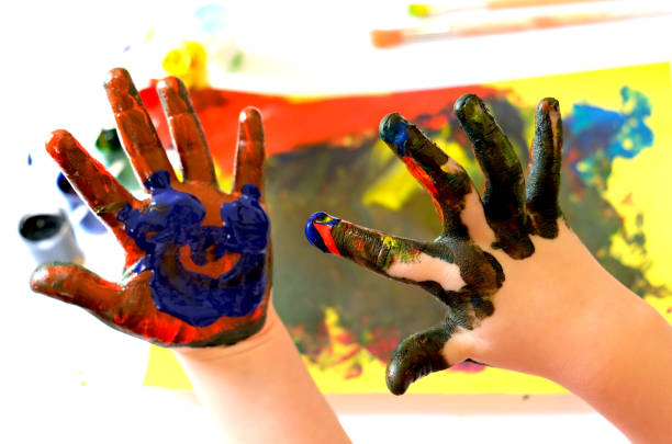 istock Child painting by finger hand . 1334036840