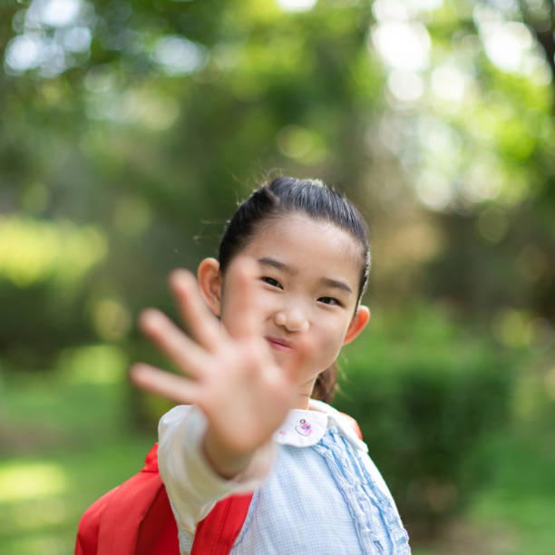 istock Little Girl Wavimg 1334038263