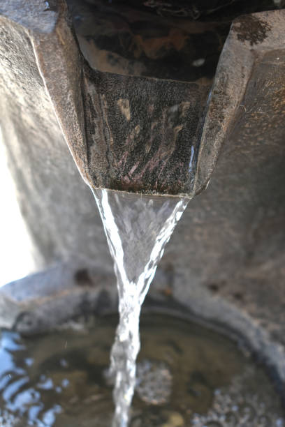 istock Water pouring from fountain 1334044987