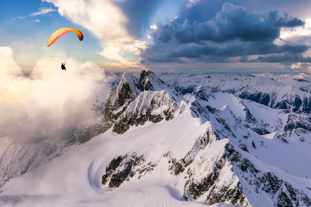 istock Paraglider Flying up high in the Rocky Mountains 1334045607