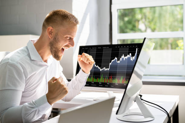 istock Excited Stock Market Broker Watching Screens 1334046574