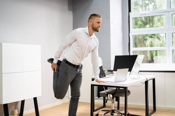 istock Yoga Workout In Office Behind Business Computer 1334046627