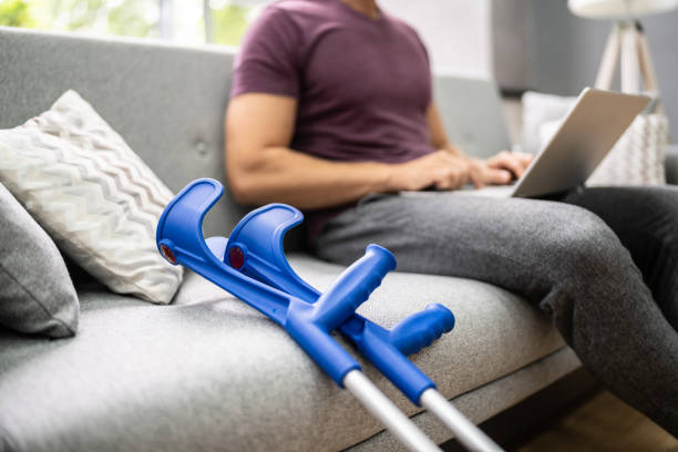 Leg Injured Man With Crutches After Accident