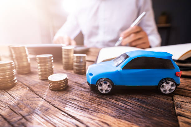 istock Calculating Car Finance And Loan Documents 1334047473