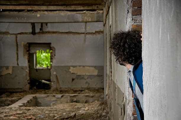 istock Homeless men looking inside of abandoned place 133404915