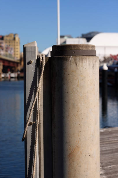istock Concrete mooring post with rope on a pier 1334049275