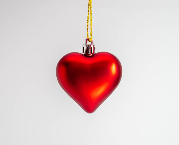 istock Christmas decorations isolated on white. Red heart on a white background. 1334050987