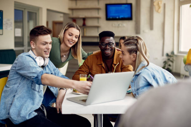 istock Happy multi-ethnic group of students using laptop on a break at cafeteria. 1334062785