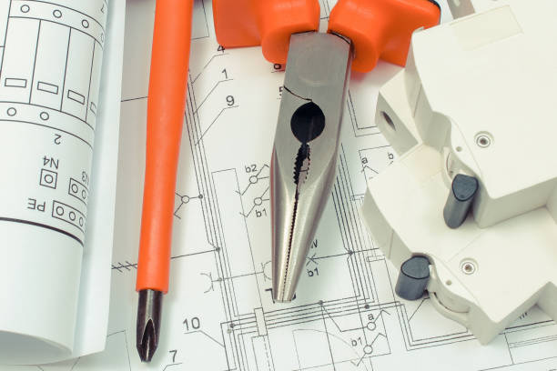 istock Electrical diagrams, electric fuse and work tools. Drawings for projects engineer jobs 1334063459