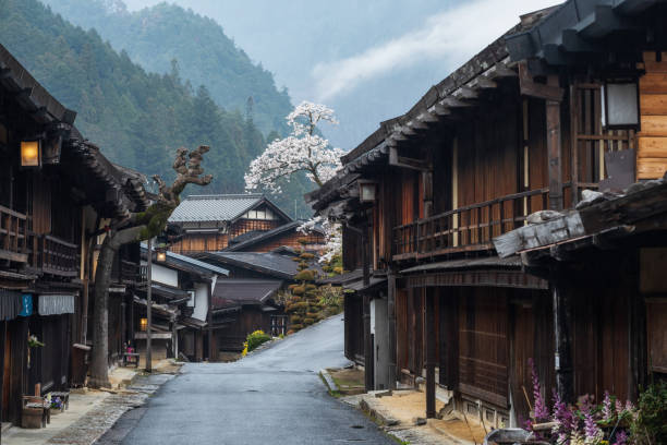 istock Tsumago juku preserved town with sakura in spring 1334064405