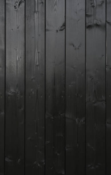 istock Vertical Black Painted wooden panels background with copy space 1334070735
