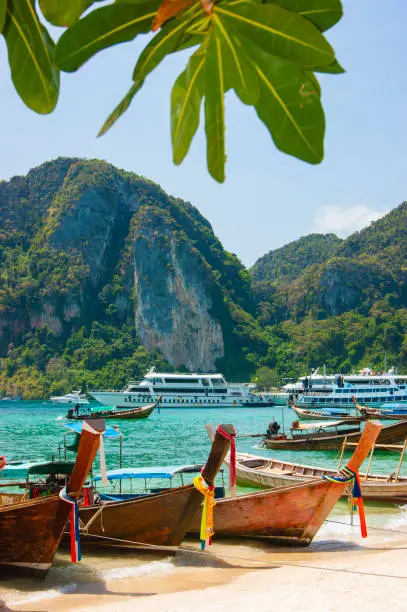 Photo of Boats at sea against the rocks in Thailand